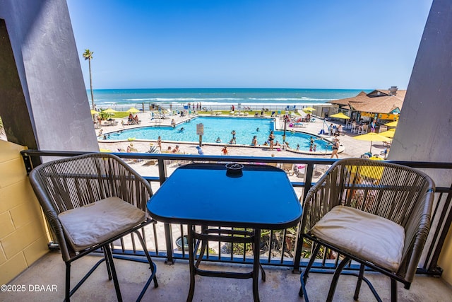 balcony featuring a water view