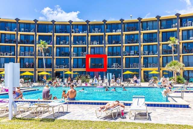 community pool featuring a patio area