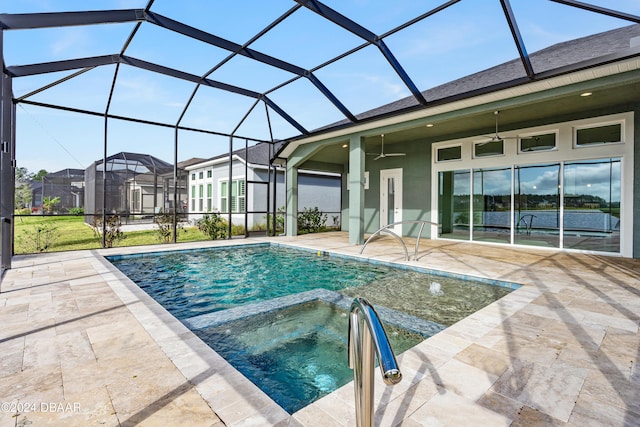 view of swimming pool with ceiling fan, a lanai, and a patio