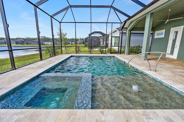 view of swimming pool featuring ceiling fan, glass enclosure, a water view, and a patio