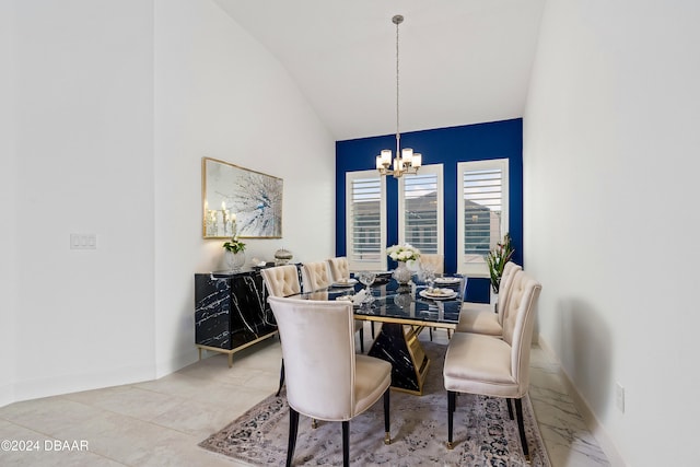 dining room featuring lofted ceiling and a chandelier