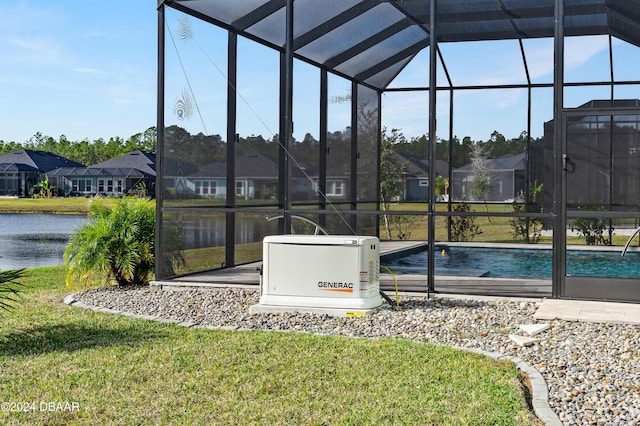 view of swimming pool featuring a lanai, a lawn, and a water view