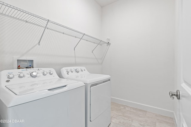 washroom with washer and dryer