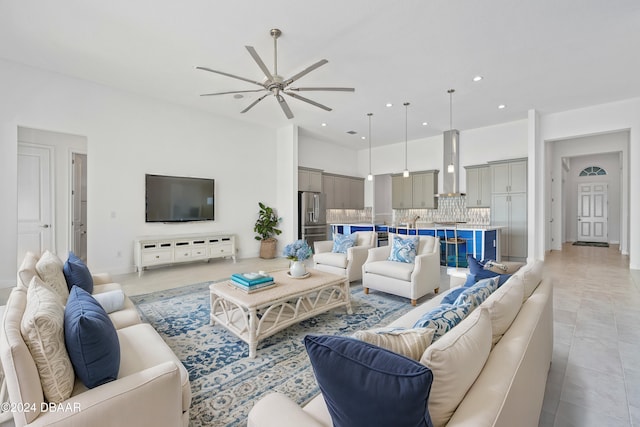 tiled living room with ceiling fan