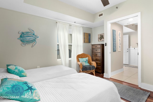 bedroom with light wood-type flooring and ceiling fan