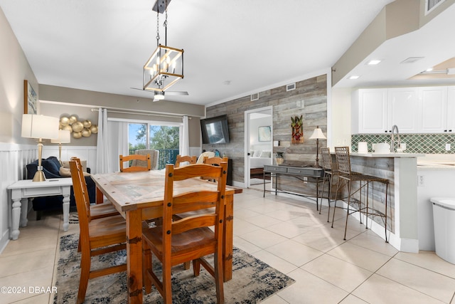 dining room with a notable chandelier and light tile patterned floors