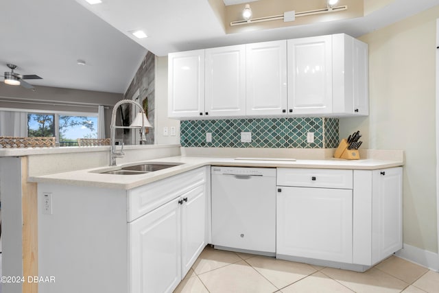 kitchen featuring kitchen peninsula, sink, white dishwasher, and white cabinets