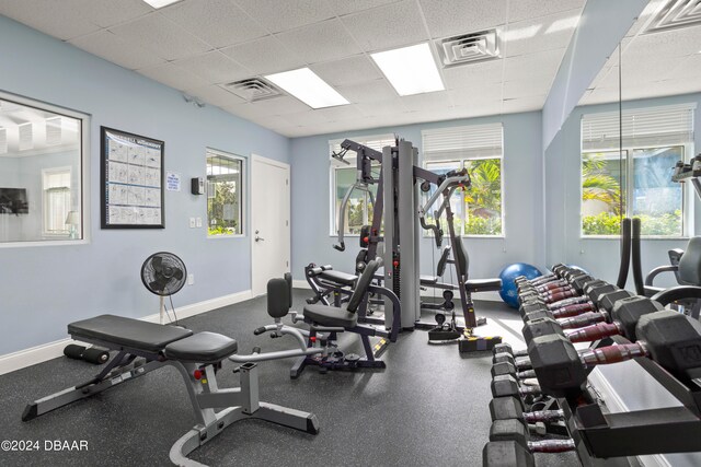 workout area featuring a paneled ceiling