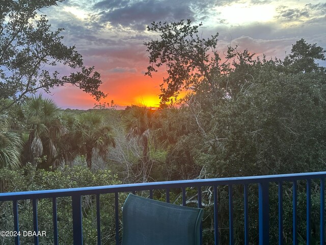 view of balcony at dusk