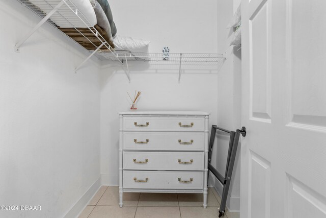 spacious closet with light tile patterned flooring