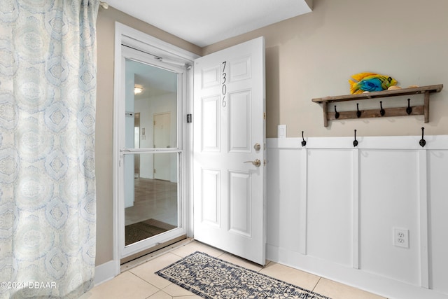 mudroom with light tile patterned floors