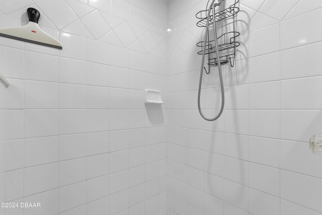 bathroom with tiled shower