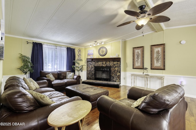 1420 Carol Lee St, Daytona Beach, FL 32117 - living room with wood-type flooring, ornamental molding, a wainscoted wall, a ceiling fan, and a fireplace