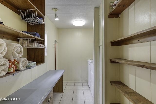 1420 Carol Lee St, Daytona Beach, FL 32117 - washroom with light tile patterned flooring and independent washer and dryer