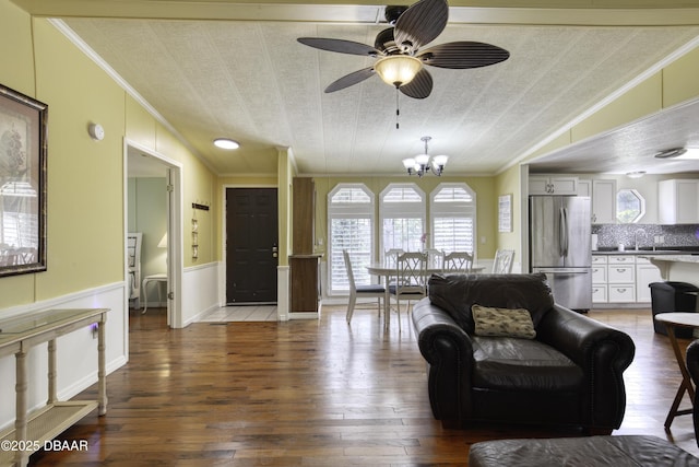 1420 Carol Lee St, Daytona Beach, FL 32117 - living area featuring ornamental molding, a ceiling fan, a chandelier, hardwood / wood-style floors, and healthy amount of natural light