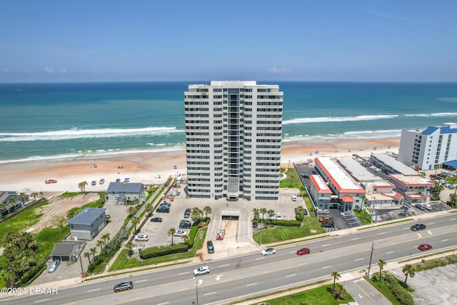 bird's eye view with a beach view and a water view