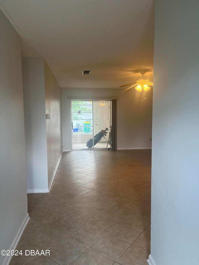 corridor with tile patterned flooring