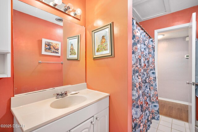 22 N St Andrews Dr, Ormond Beach, FL 32174 - bathroom featuring vanity, a shower with curtain, and tile patterned flooring