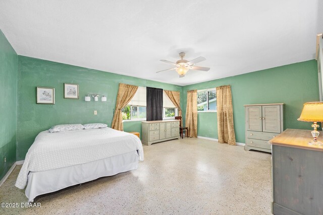22 N St Andrews Dr, Ormond Beach, FL 32174 - bedroom with speckled floor and a ceiling fan