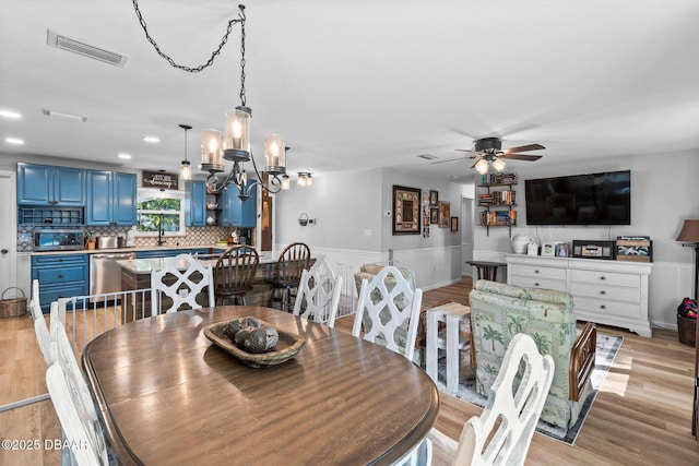 dining room with ceiling fan and light wood-type flooring