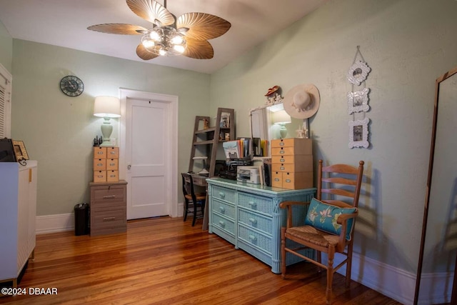 sitting room featuring ceiling fan and hardwood / wood-style floors