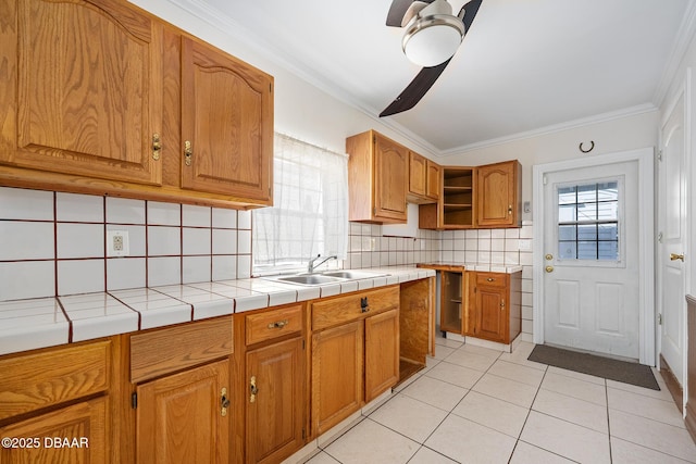 1650 Riverside Dr, Holly Hill, FL 32117 - kitchen featuring ceiling fan, crown molding, light tile patterned flooring, tasteful backsplash, and open shelves