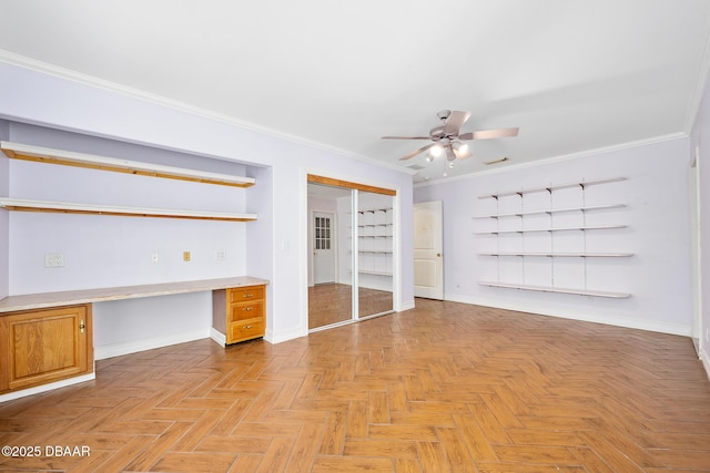 1650 Riverside Dr, Holly Hill, FL 32117 - unfurnished bedroom featuring built in study area, crown molding, a ceiling fan, and a closet