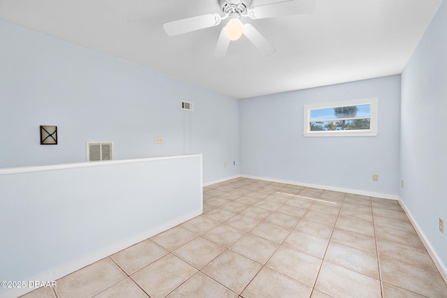 1650 Riverside Dr, Holly Hill, FL 32117 - unfurnished room featuring light tile patterned flooring and ceiling fan