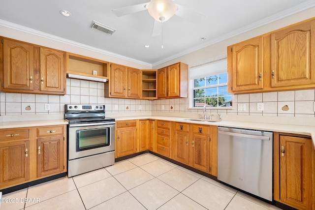1650 Riverside Dr, Holly Hill, FL 32117 - kitchen featuring appliances with stainless steel finishes, open shelves, crown molding, brown cabinets, and light countertops