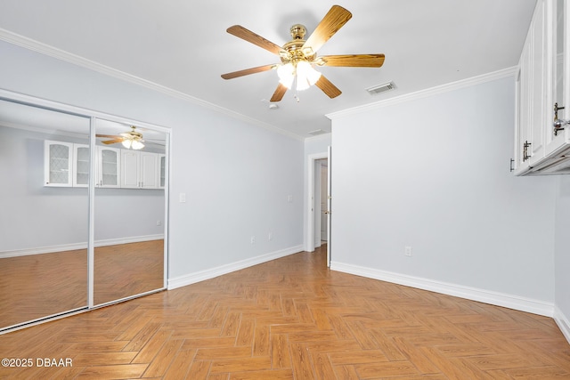 1650 Riverside Dr, Holly Hill, FL 32117 - unfurnished bedroom featuring crown molding, a ceiling fan, and a closet