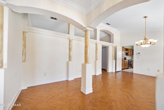 1650 Riverside Dr, Holly Hill, FL 32117 - foyer featuring crown molding, a chandelier, and arched walkways