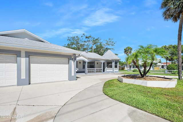 1650 Riverside Dr, Holly Hill, FL 32117 - ranch-style home featuring concrete driveway, covered porch, stucco siding, and a garage