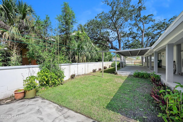 1650 Riverside Dr, Holly Hill, FL 32117 - fenced backyard with a patio area