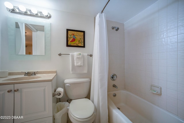 full bathroom featuring shower / bath combo with shower curtain, vanity, and toilet