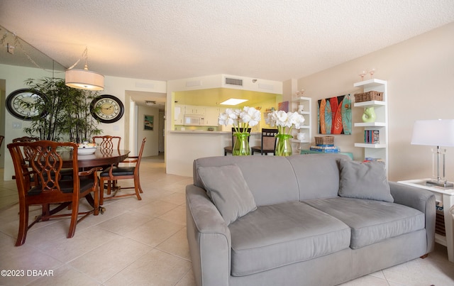 tiled living room with a textured ceiling