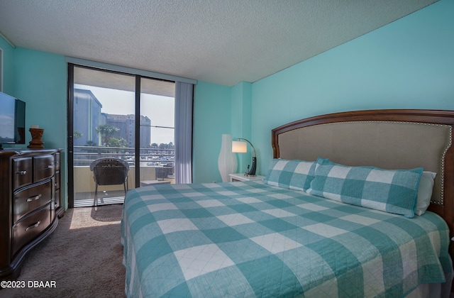 carpeted bedroom featuring a wall of windows, a textured ceiling, and access to outside