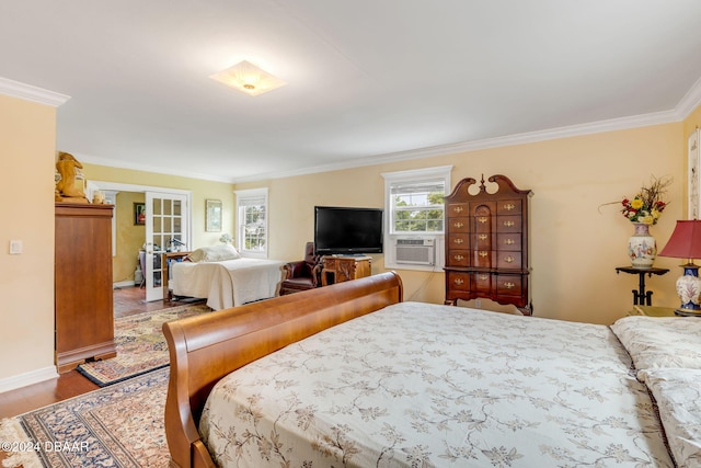 bedroom featuring cooling unit, french doors, and ornamental molding