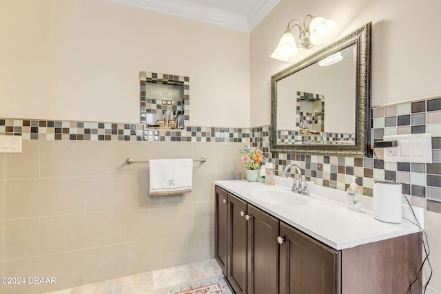 bathroom with tile walls, vanity, tile patterned floors, and crown molding