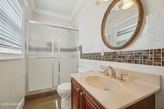 bathroom featuring toilet, tile walls, ornamental molding, vanity, and walk in shower