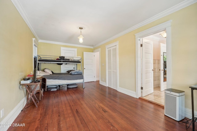 bedroom featuring hardwood / wood-style floors and crown molding