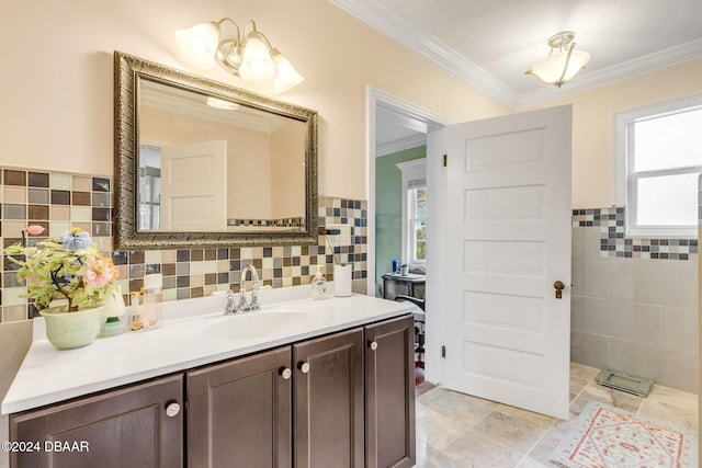 bathroom featuring tile walls, vanity, and crown molding