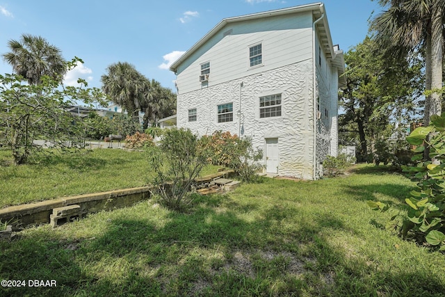 back of house with a yard