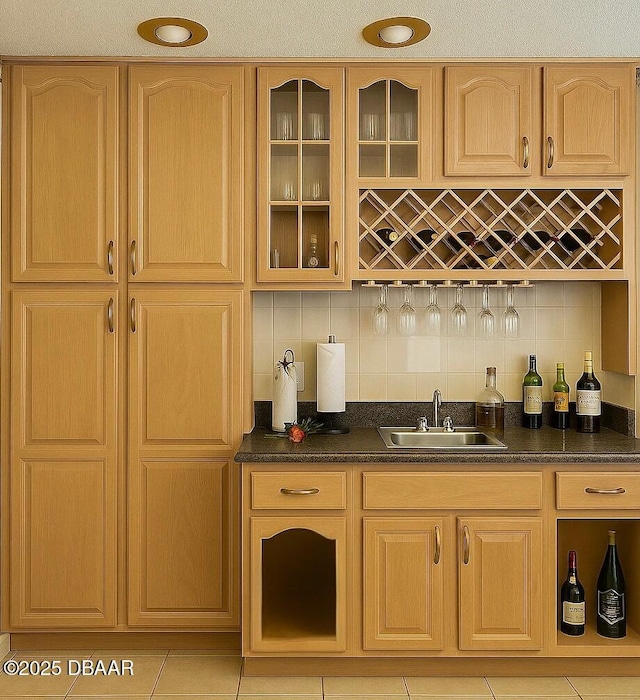 2944 Ocean Shore Blvd, Ormond Beach, FL 32176 - indoor wet bar featuring backsplash and light tile patterned floors