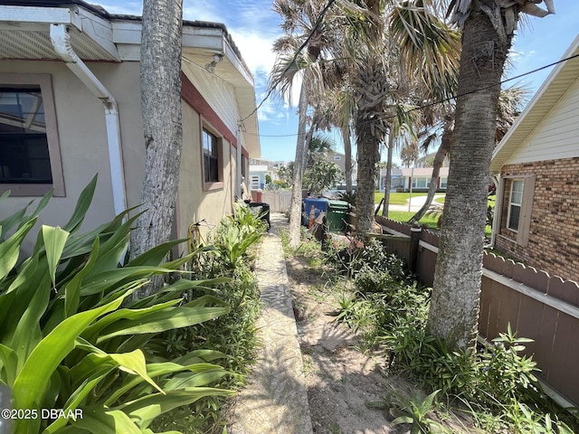 2944 Ocean Shore Blvd, Ormond Beach, FL 32176 - view of side of property with fence and stucco siding