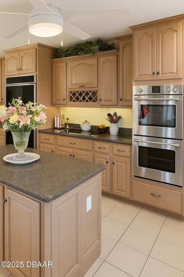 2944 Ocean Shore Blvd, Ormond Beach, FL 32176 - kitchen featuring double oven, dark countertops, fridge, light brown cabinetry, and light tile patterned floors