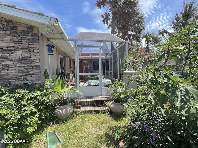 2944 Ocean Shore Blvd, Ormond Beach, FL 32176 - view of yard featuring glass enclosure
