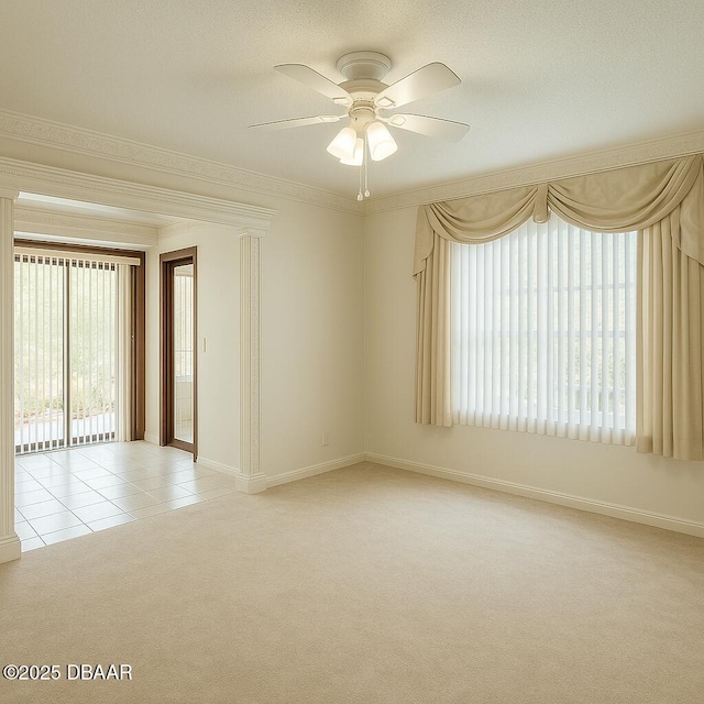 2944 Ocean Shore Blvd, Ormond Beach, FL 32176 - carpeted spare room with a ceiling fan, baseboards, ornamental molding, and tile patterned flooring