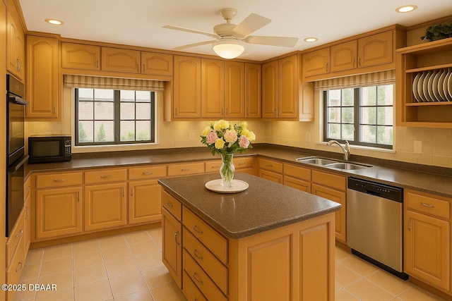 2944 Ocean Shore Blvd, Ormond Beach, FL 32176 - kitchen with black appliances, a sink, dark countertops, backsplash, and a kitchen island