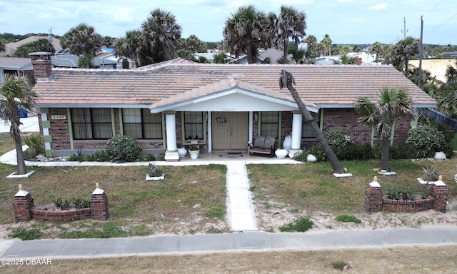 2944 Ocean Shore Blvd, Ormond Beach, FL 32176 - view of front of home featuring brick siding and a porch
