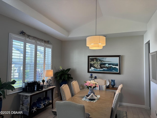 168 Ocean Hammock Loop, Daytona Beach, FL 32124 - dining space featuring lofted ceiling, healthy amount of natural light, wood finished floors, and baseboards